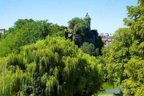 Suspended footbridge over the lake in the Buttes-Chaumont park 19th arrondissement of Paris city