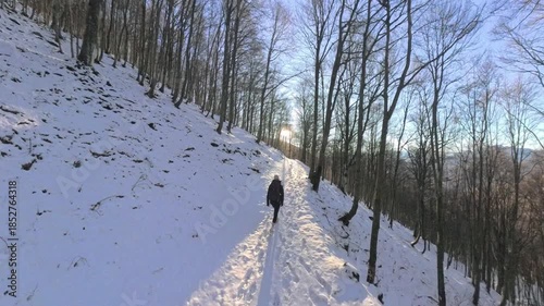 Monte Lema, Varese, Italy: She follows a path of light where the snow is illuminated by the sun in shadow.