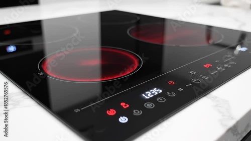 Modern induction cooktop on kitchen counter