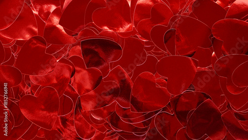 Closeup shot of shiny burgundy confetti in the shape of hearts