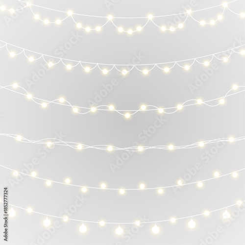 Soft glowing Christmas lights forming decorative border. Festive garland isolated on transparent background. Ideal for web banners, greeting cards, and seasonal ads.