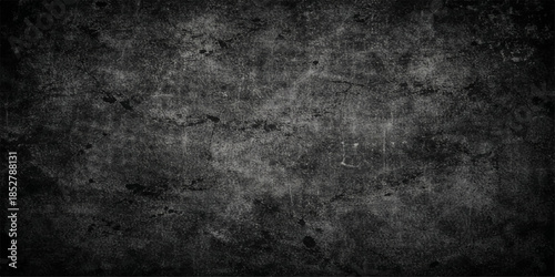 A dark and dirty vintage grunge wall background features a rough grey concrete texture with an aged stone pattern and black paint splatters on a blank textured surface