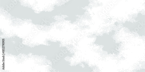 Abstract blue grunge sky background with copy space featuring bright white clouds and sunny summer sunlight in a beautiful clear day atmosphere