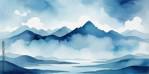 Beautiful winter mountain landscape featuring snow-capped peaks under a blue sky with soft clouds and a golden sunset glowing over the high alpine valley scenery