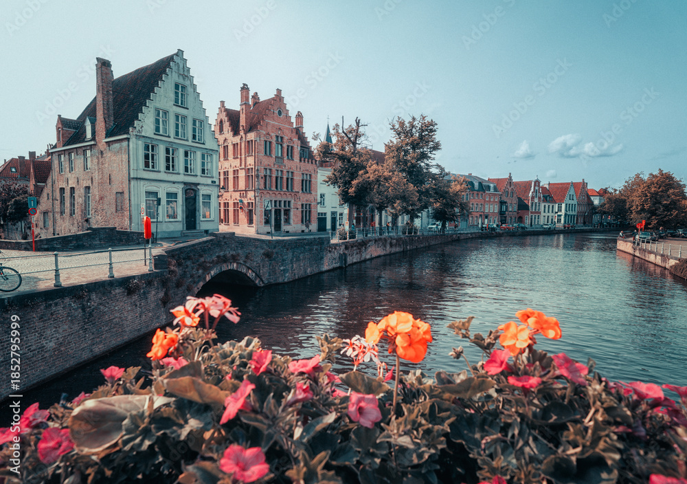Naklejka premium Historic medieval city of Bruges, Belgium. Beautiful scenic view of canals, ancient architecture and landmarks in the Venice of the North.