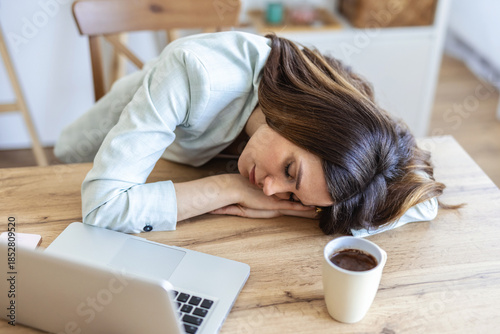 Tired, sleeping and woman on laptop for remote work exhausted for project, report and working from home. Stress, overworked and female person with burnout for nap, relaxing and resting from fatigue.