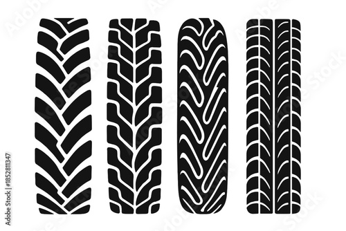 Four black tire treads on a grey background