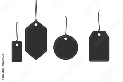 Four different shaped price tags hanging against a dark background