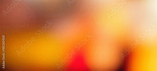 Warm-toned abstract background with grainy texture and soft blur blending yellow, orange, and red hues, suitable for artistic and modern design use.