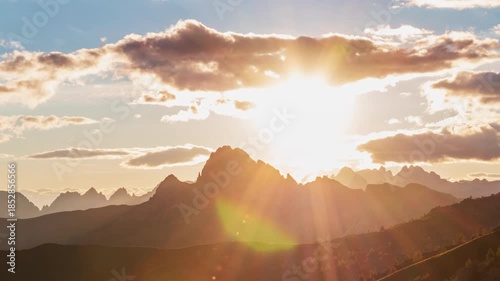 Timelapse of sunset over mountain peak, Dolomites, Italy 
