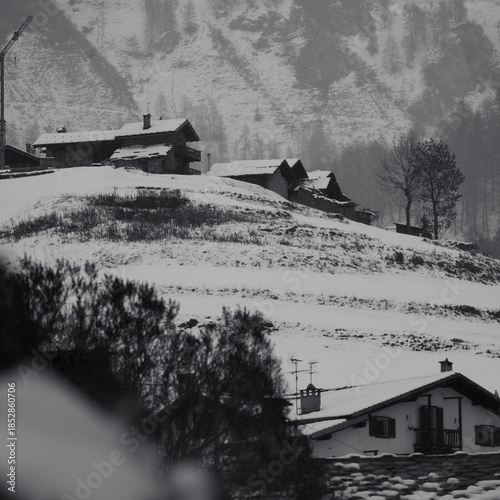 village huts in winter in snowfall