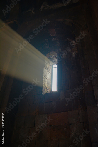 Monastery interior. An old lamp in the church. Sunlight streaming through the windows. Christianity and religion.