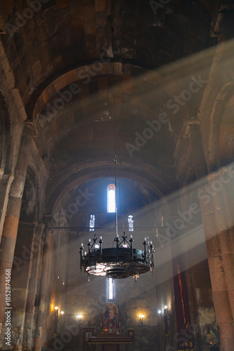 Monastery interior. An old lamp in the church. Sunlight streaming through the windows. Christianity and religion.
