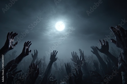 Night scene of many hands reaching upwards beneath a luminous moon and cloudy sky