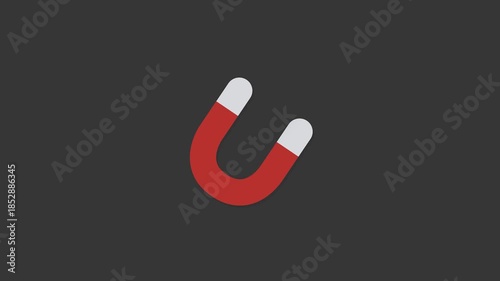 Magnetic Attraction: A vibrant U-shaped magnet, its red body and contrasting silver ends command attention, positioned against a dark background, representing the essence of attraction and power.