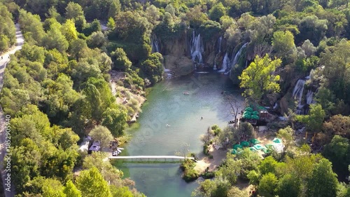 River pool surrounded by forest and small waterfalls in Bosnia and Herzegovina