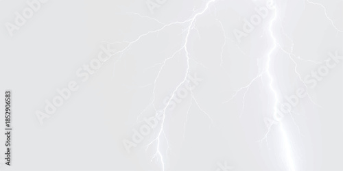 A powerful white lightning strike illuminates the pale sky during a severe thunderstorm
