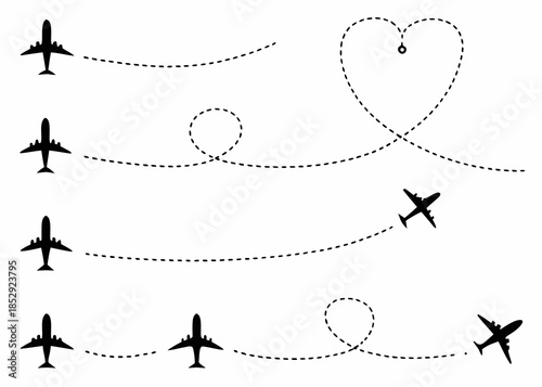 Airplanes tracing flight paths including a heart shape and circular routes