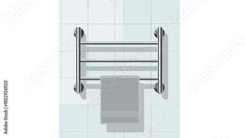 A sleek chrome heated towel rail with a neatly folded grey towel hangs on a white tiled bathroom wall, providing warmth and comfort.