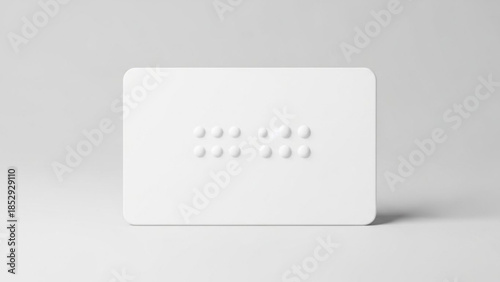 White braille card with raised dots representing accessibility and communication for the visually impaired isolated on a clean white background