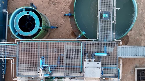 aerial view of clarifiers at a wastewater treatment facility, top down, process to clean and make drinkable water