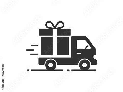 A delivery truck transports a large gift box with a ribbon.