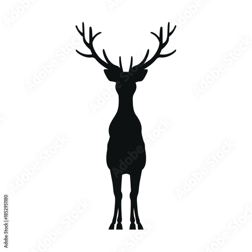 A majestic stag with impressive antlers standing alone in a serene environment