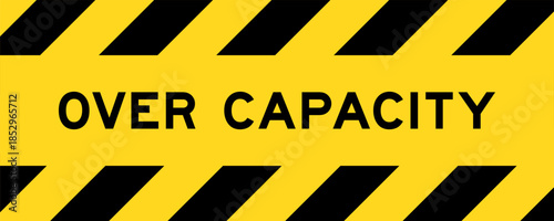 Yellow and black color with line striped label banner with word over capacity