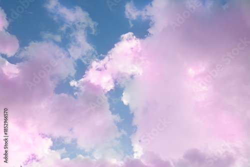 Dreamy and fantasy pink clouds at the blue sky with pastel tones