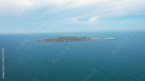 Wallpaper Mural Aerial view of St. Ivan Island, a verdant oasis amidst the vast blue sea, creating a striking contrast between the lush greenery and the surrounding waters, Sozopol, Bulgaria. Torontodigital.ca
