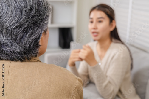 Counselor, psychologist, family therapy session, mental health, woman coping with trauma and anxiety, counseling with parents, stress and sadness during family crisis, professional guidance offering