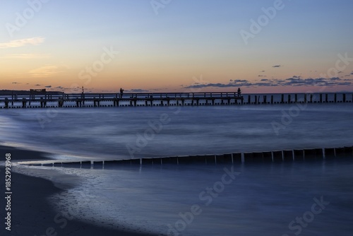 Wallpaper Mural Groves and wooden walkway in the sea, sunset, long exposure, Zingst, Fischland-Darß-Zingst, Western Pomerania Lagoon Area National Park, Mecklenburg-Western Pomerania, Germany Torontodigital.ca