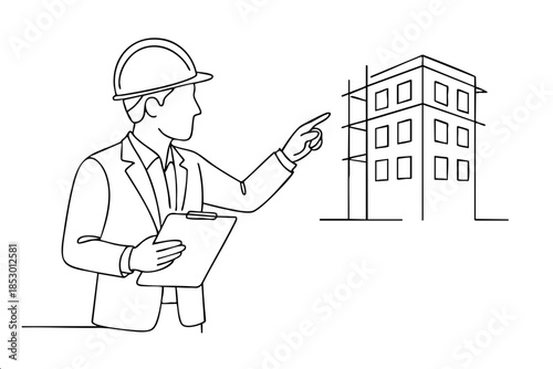 A man in a hard hat points to a building. He is holding a clipboard. The building is tall and has many windows