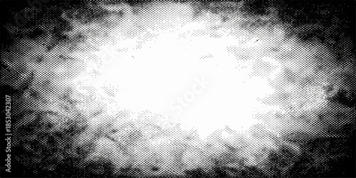 An abstract dark storm cloudscape blends deep blue and gray tones with a burst of white sun light breaking through the misty nature background