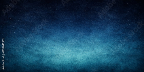 A dark blue grunge background with a vintage textured pattern features an aged rough wall design and dark purple paper material for a blank grungy backdrop