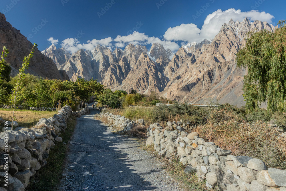 Fototapeta premium Path in Hunza valley under Passu (Cathedral) cones, Gilgit-Baltistan region of Pakistan