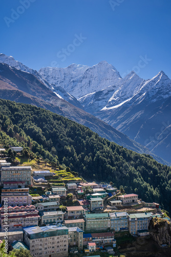 High-rise lodges and hotels in Namche bazaar, a capital of Khumbu region, against Kusum Khangkaru peak. Himalaya mountains, Nepal.