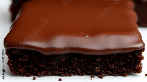 Detailed View Of A Decadent Chocolate Sponge Cake Featuring A Smooth Thick Fudge Icing Layer