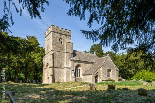 The parish church of St Peter dating back to the 13th century in the Cotswold village of Alvescot, Oxfordshire, England UK