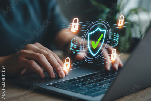 Cybersecurity concept with businessman working on laptop and virtual lock icon image