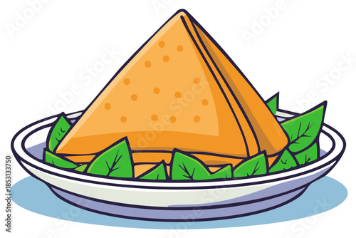 Triangular savory pastry with green leaves on a plate