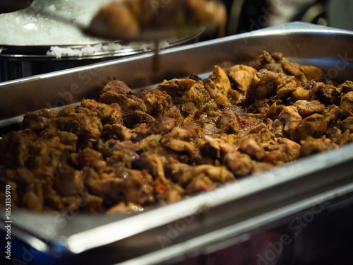 Dish of fresh spicy curry at buffet