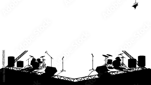 Silhouetted concert stage with drum sets and microphones ready for performance.