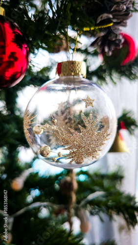 Close-up of Festive Pinecone and Glitter Star Ornaments on a Christmas Tree