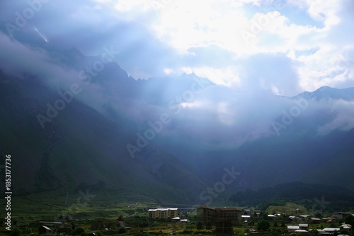 фотографія Morning sun rays in the mountains of Georgia.