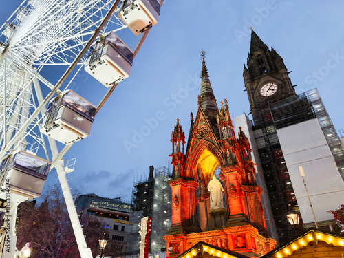 Konstfotografi Giant Ferris wheel beside illuminated Gothic church in Manchester city centre UK