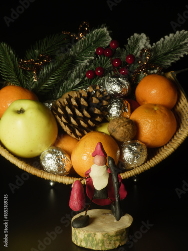 Christmas fruit basket with handmade clay figurine