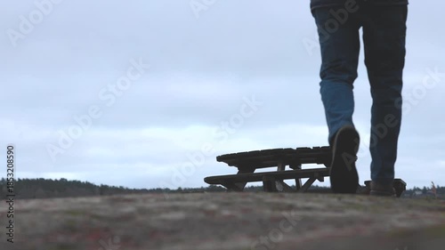 Stockholm, Sweden A man walks on a icy path in the winter countryside.