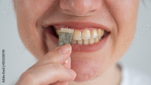 Photos A woman uses chewing tobacco.