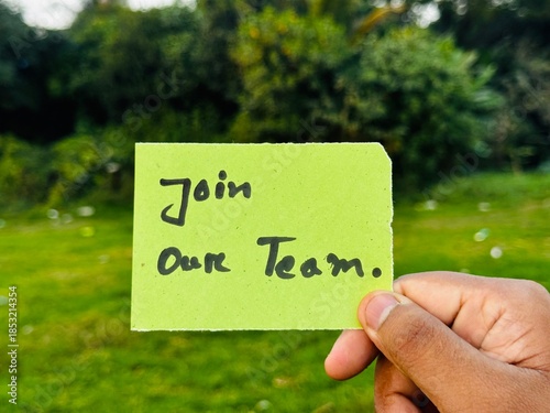 We are hiring trendy card post holding by hand, Join our team recruiting message, Drop your CV sticky note message, Vacancy here image